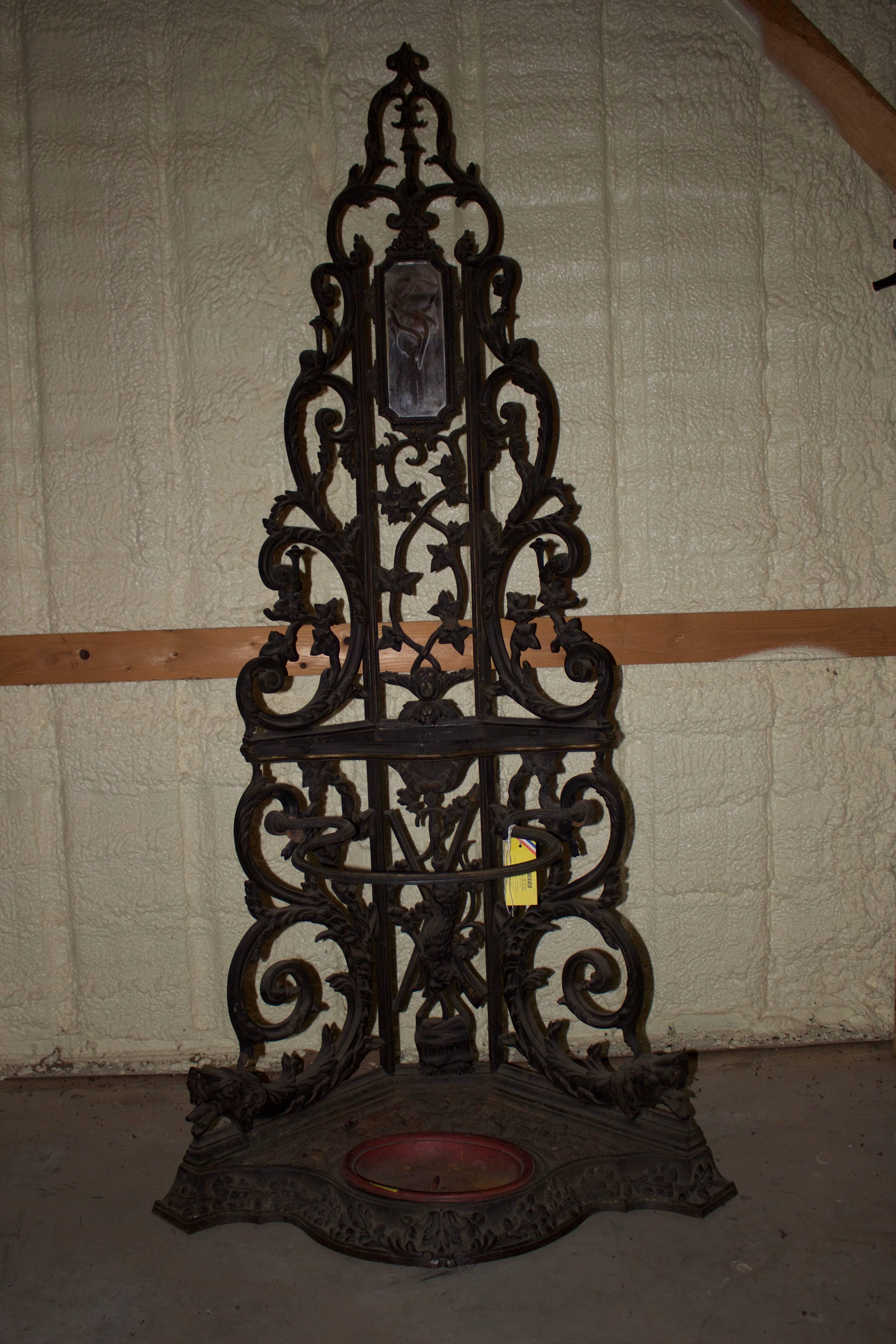 A French cast iron corner hall tree with a hunt motif.