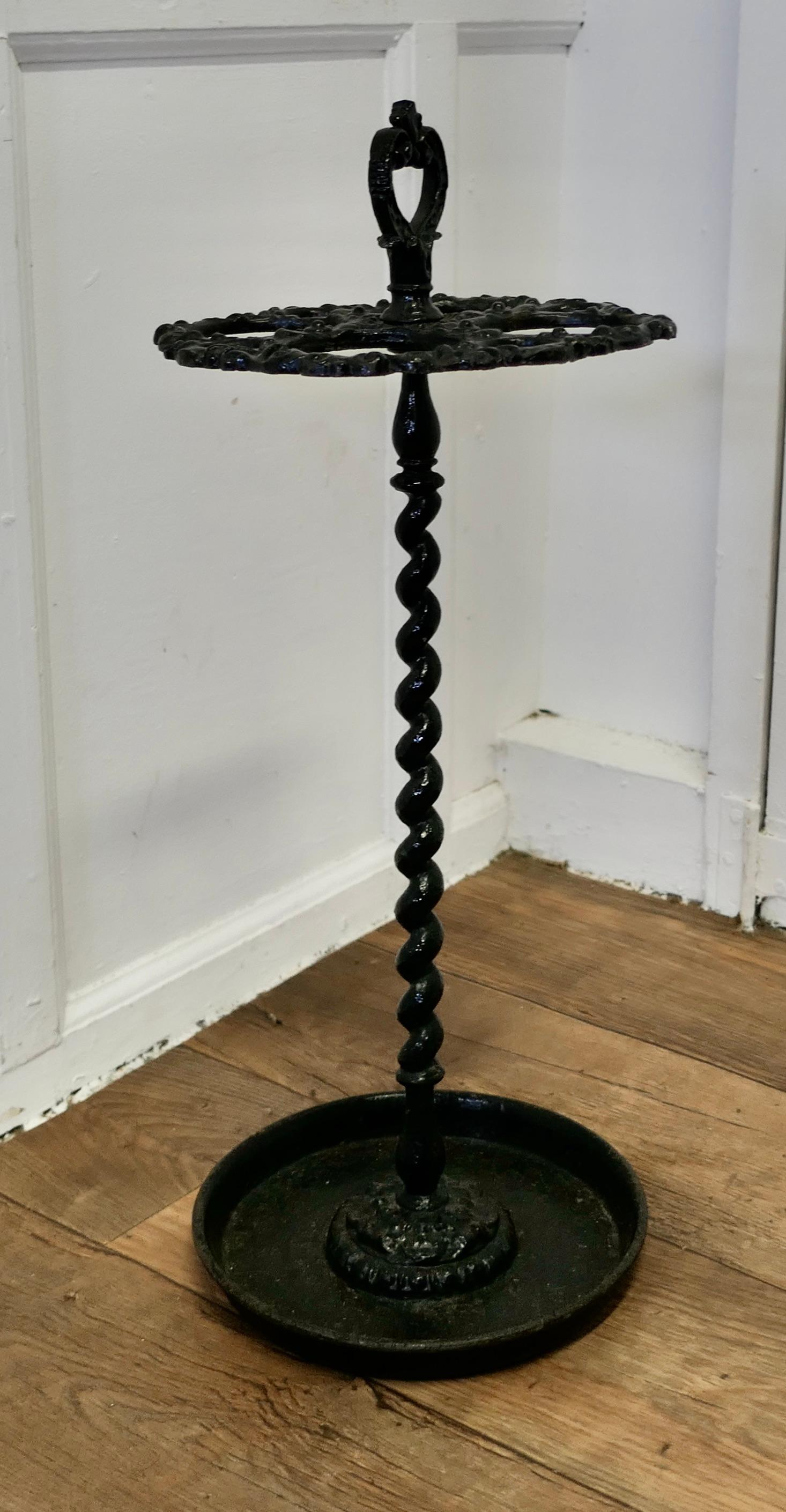 A French Cast Iron Walking Stick Stand or Umbrella Stand

A charming piece, the round stand is divided into 8 sections to hold either Walking Sticks or Umbrellas, the heavy iron base is also the drip tray and it has a handle on the top
The stand is