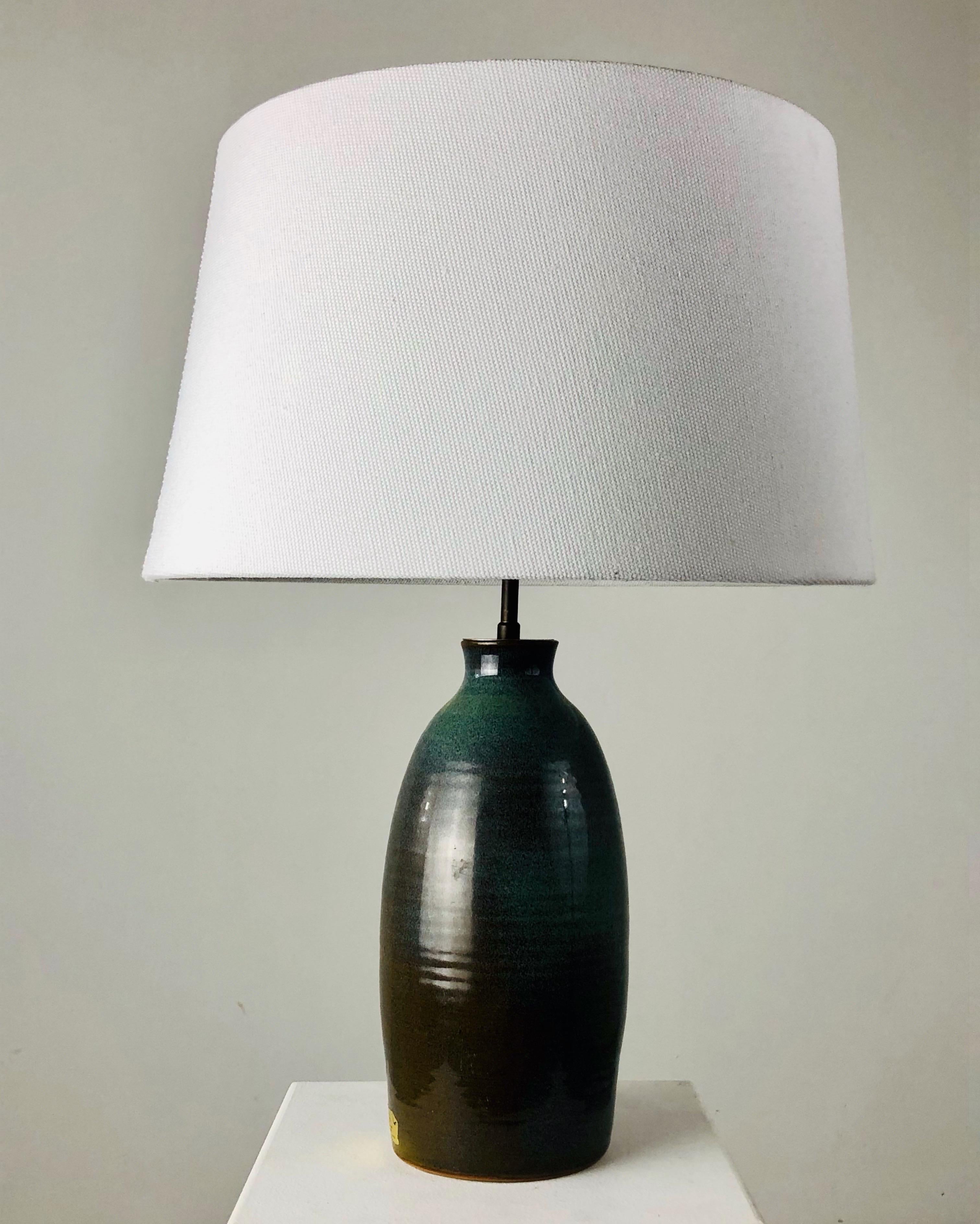 A french ceramic hand turned lamp. 
Fabulous enamal.

Fully rewired with shade fully refurbished.

Measures: Height with the shade: 52 cms.
  