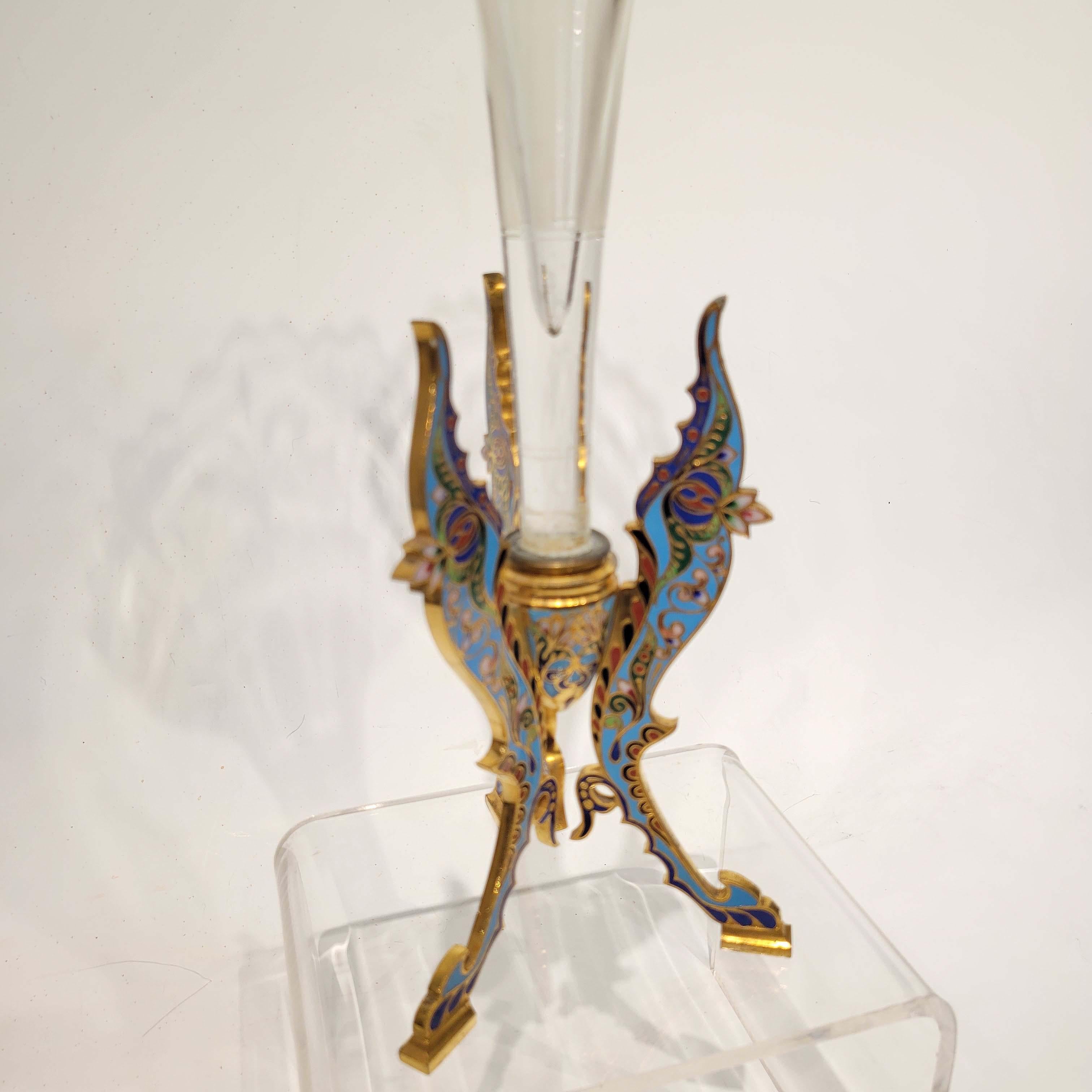 A magnificent quality champleve enamel on gilt bronze base holding an etched crystal trumpet vase. French, circa late 19th century. Attributed to Ferdinand Barbedienne foundry, Paris.
There are a few small chips on the glass at the very top,