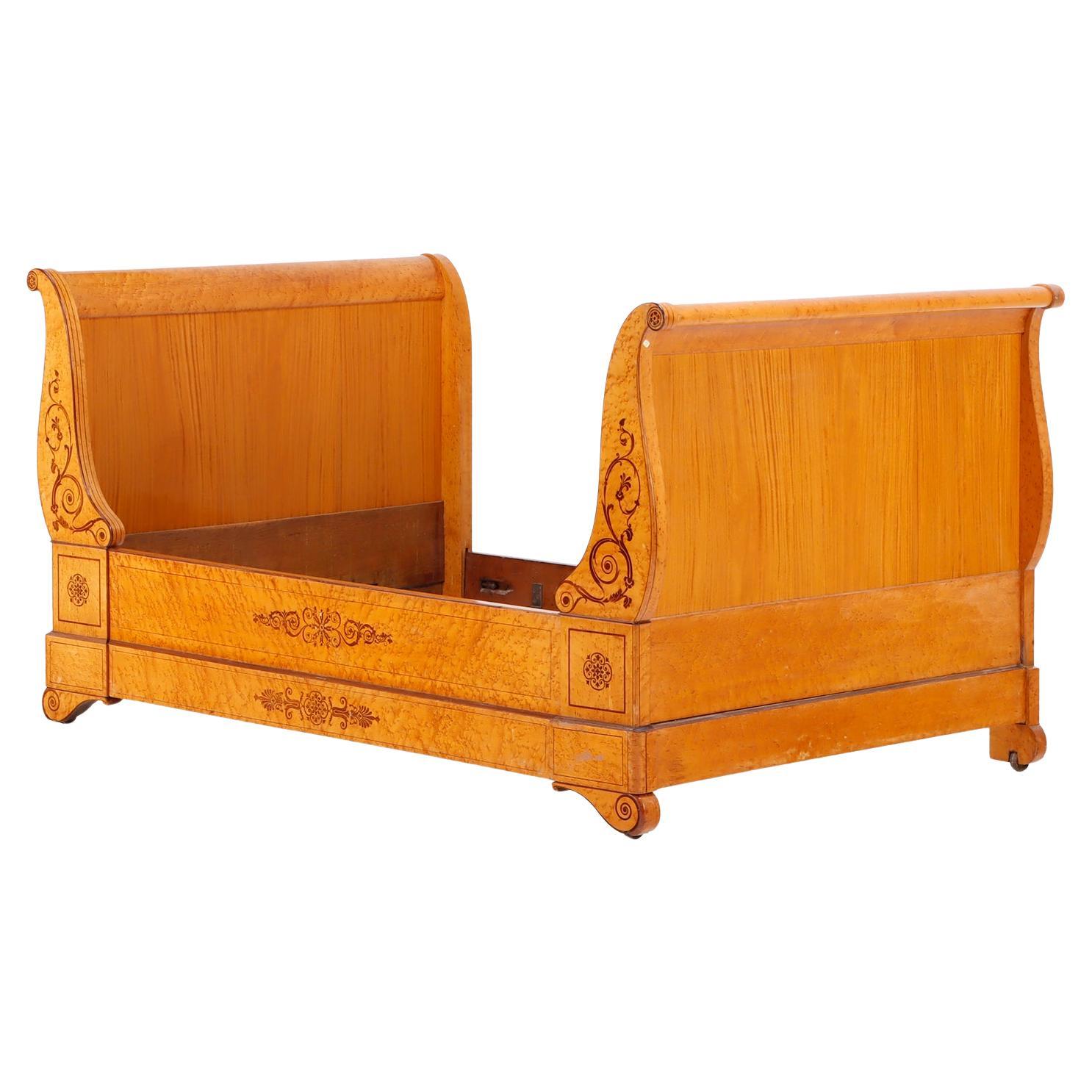 A French Charles X inlaid birdseye maple daybed, C. 1840. For Sale