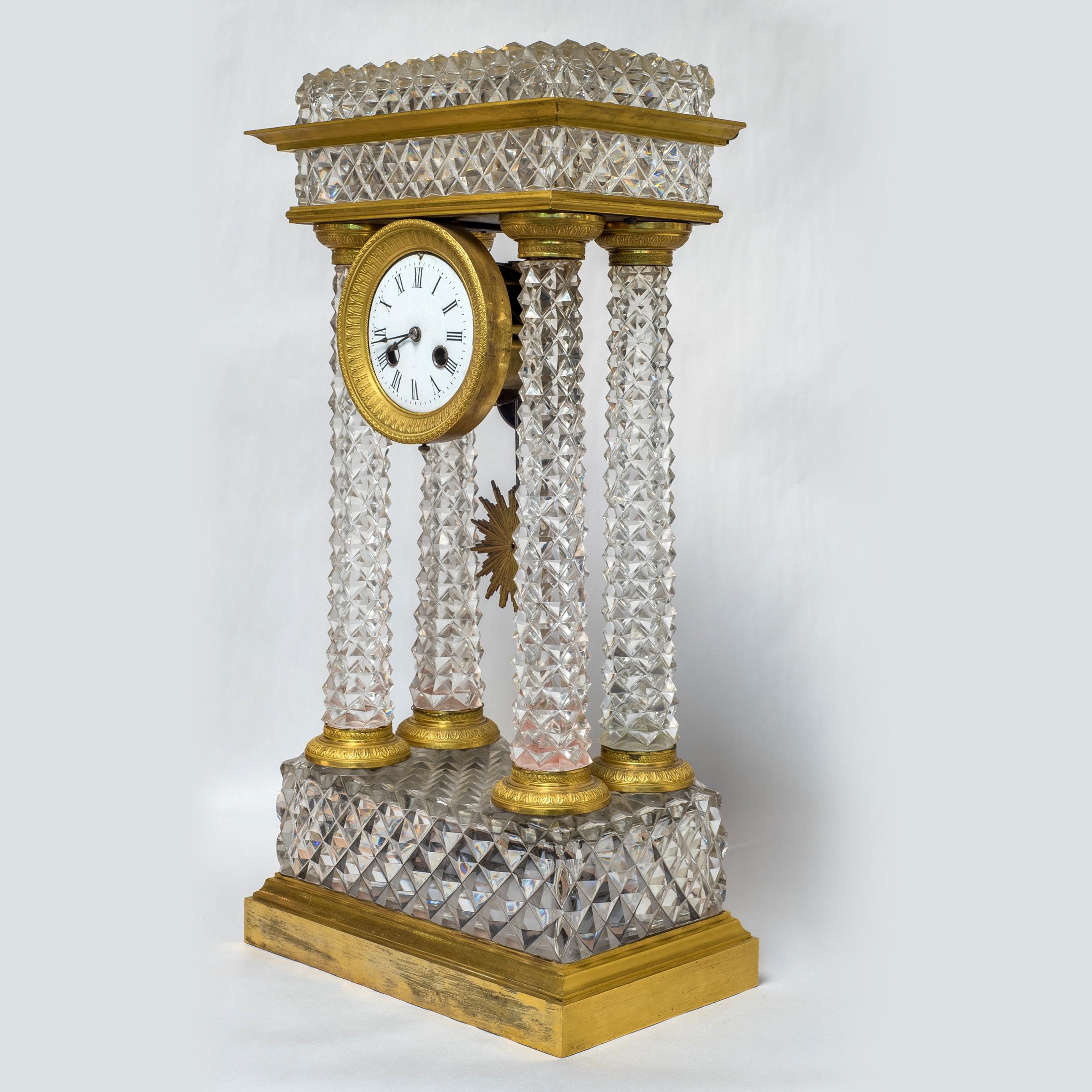 A fine Charles X Ormolu and cut-glass portico mantel clock

Date: circa 1825
Origin: French
Dimension: 19 x 9 3/4 x 6 inches.