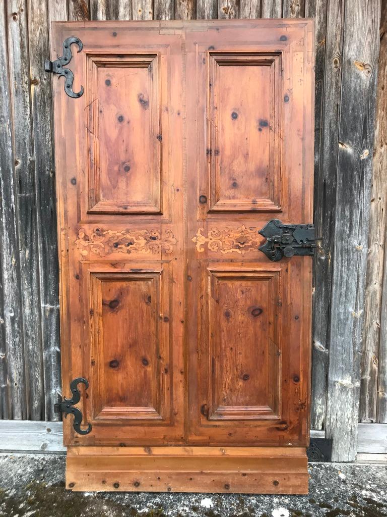A Large French chateau door. This door has been crafted beautifully and inlaid with wood with wrought iron accessories.