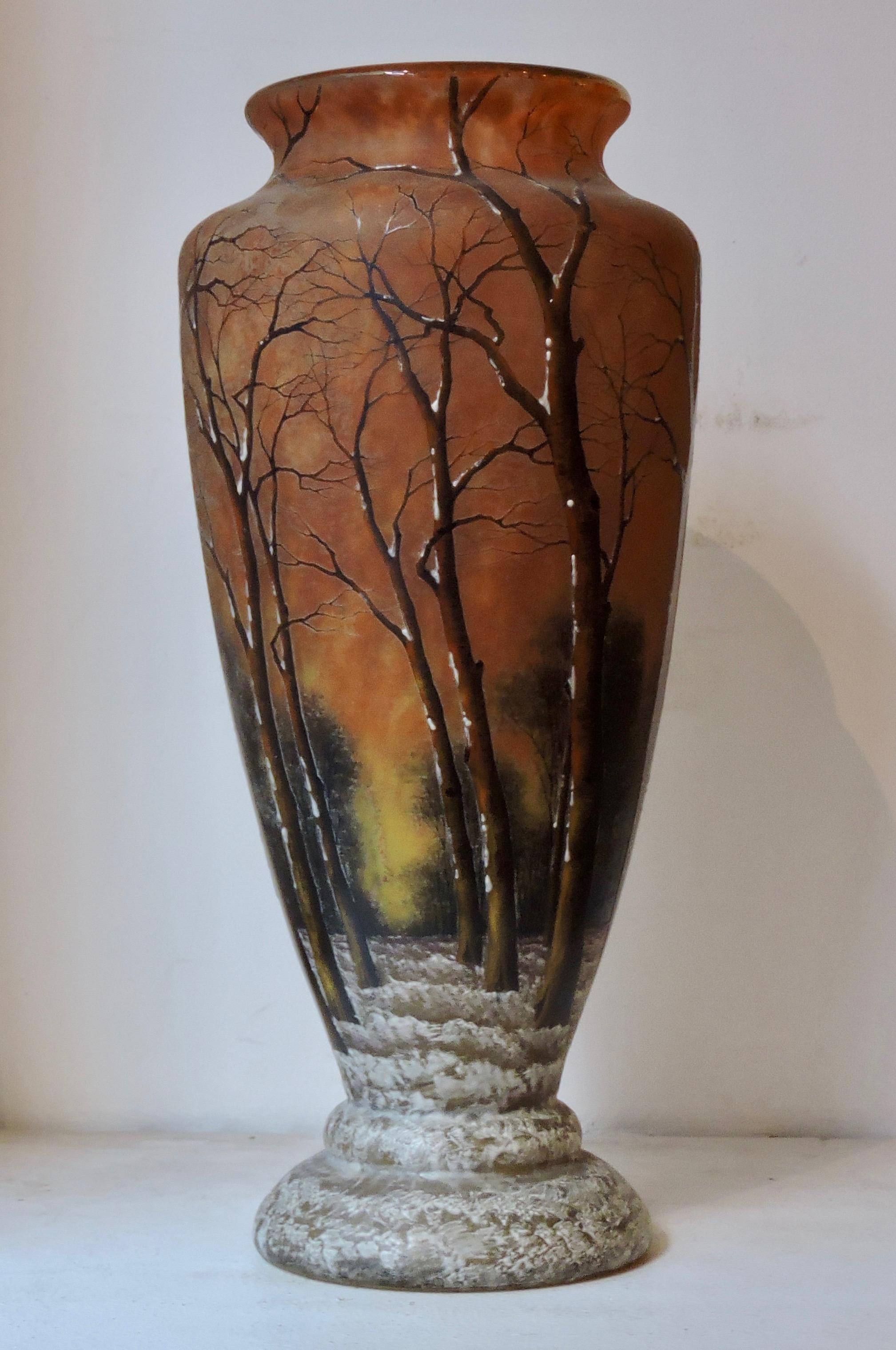 A French Daum Nancy enameled winter landscape glass vase, circa 1900
Acid-etched in relief and enameled in colors with trees and snow.
Signed Daum Nancy and Croix de Lorraine.