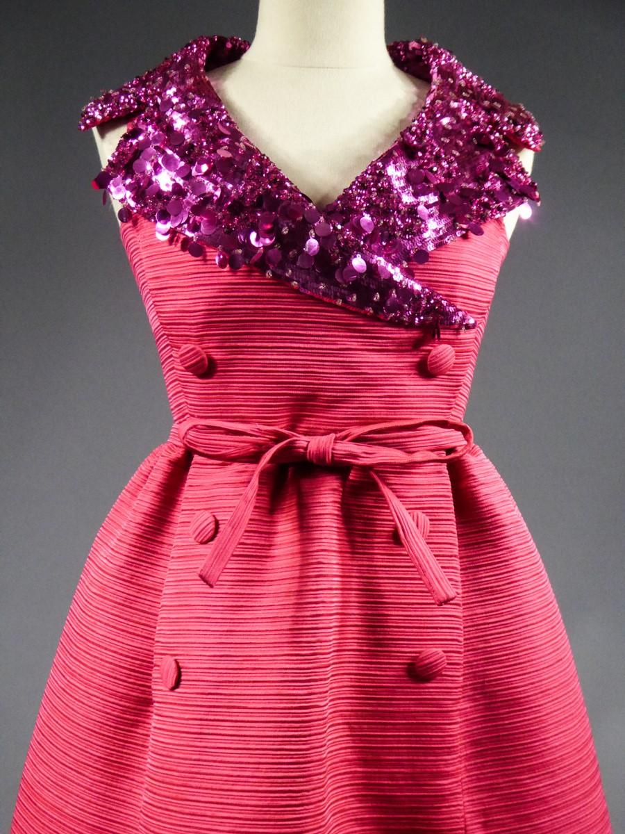 Circa 1965
France

Rare and astonishing Haute Couture Shocking Pink evening dress from Maguy Rouff designer house dating from the last period of the famous French designer house around 1965. Thick ribbed silk ottoman to the stability and rigidity of