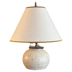 A French crackle glazed ceramic lamp with bespoke shade