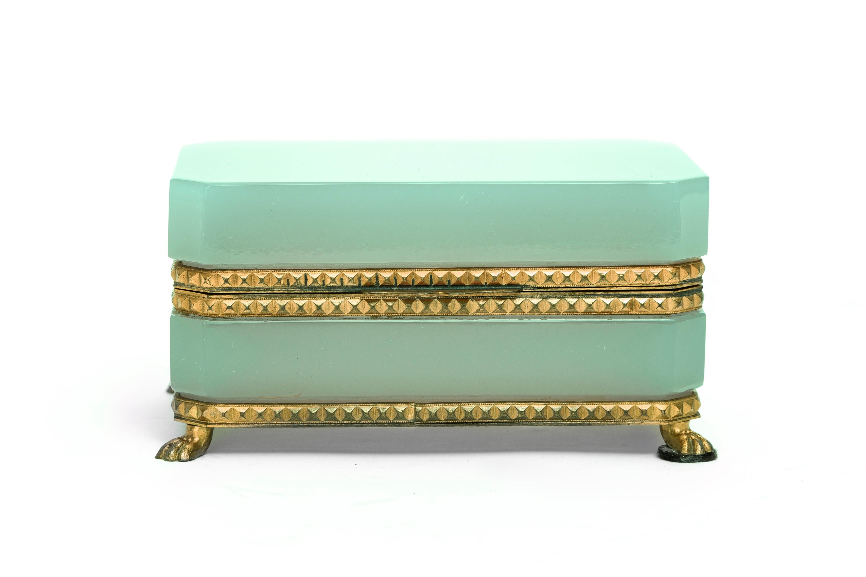 A French  Dichroic Opaline Crystal Dore Bronze Mounted Green & Pink Colored Box.  This absolutely gorgeous jewelry box showcases opaque pale pink and pale green Dichroic Crystal. The dore bronze mounts elevate the aesthetic with a diamond-stylized