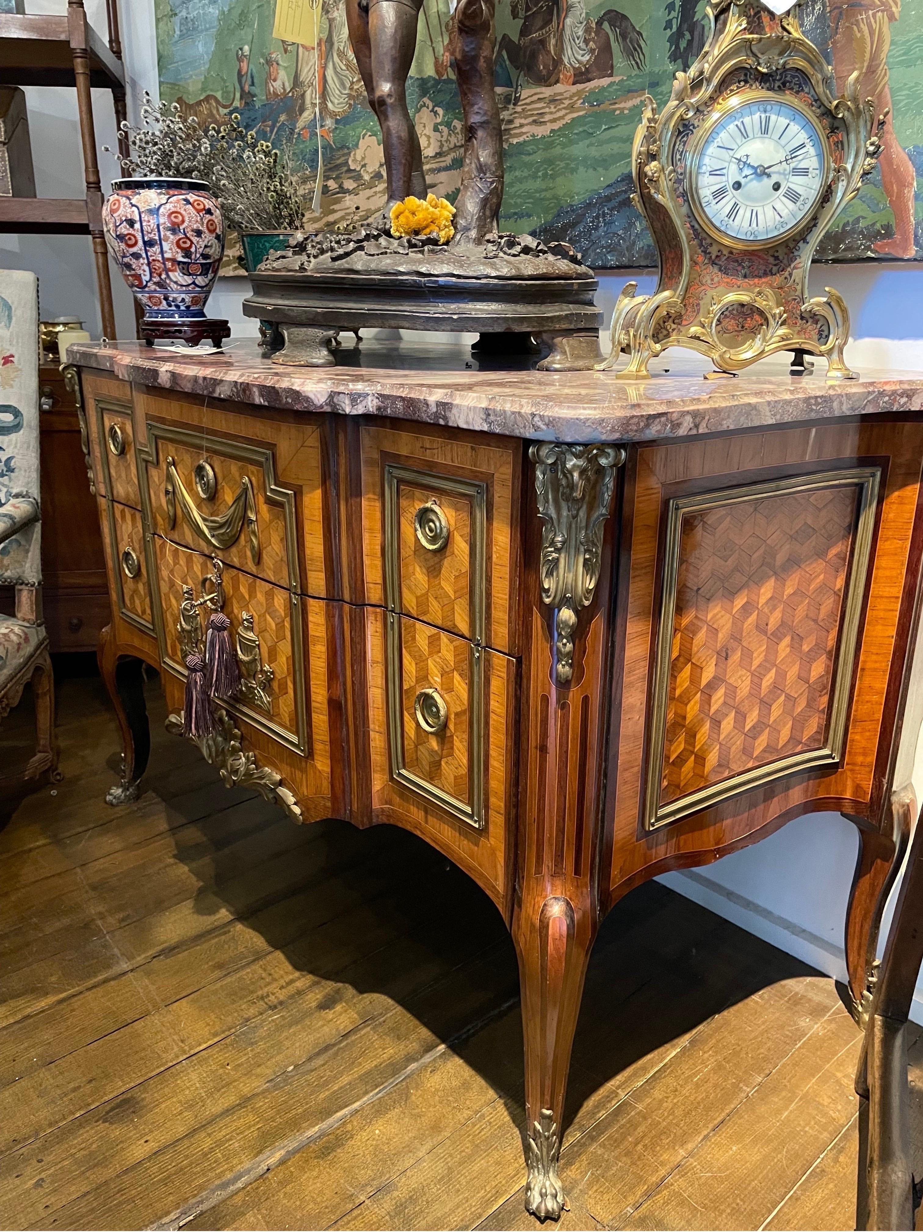 A French Directoire Gilt Bronze Mounted Parquetry Commode With Marble Top, 19th Century

Provenance: Private Australian Collection Acquired in 1980s.

Dimension: Height: 95cm Width: 145cm Depth: 65cm.