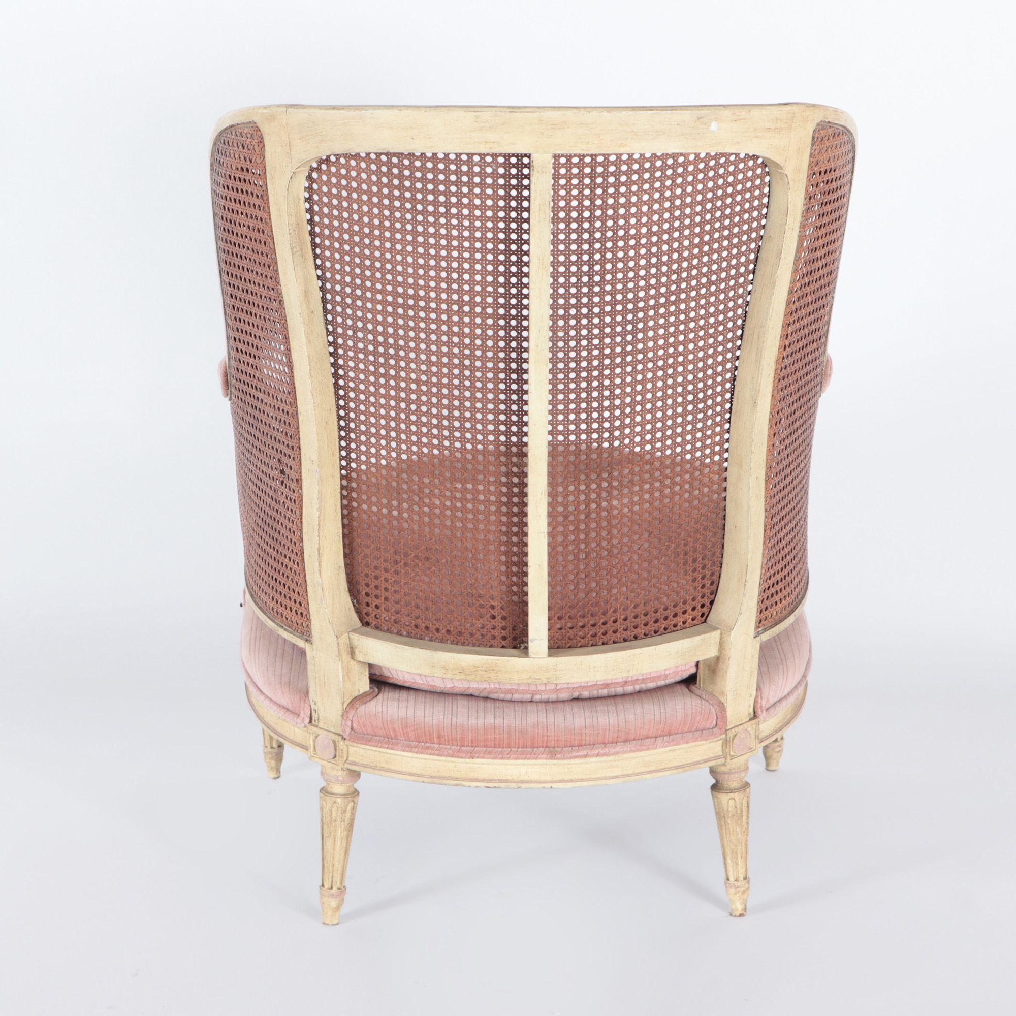 Late 19th Century French Directoire Style Painted and Cain Bergere Chair with Conforming Ottoman