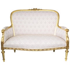 A French Early 20th Century Louis XVI Style 9-Piece Giltwood Carved Salon Suite