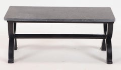A French ebonized Empire style marble top coffee table with bronze mounts.