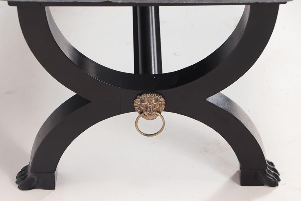 A French ebonized Empire style marble top coffee table with bronze mounts.  In Good Condition For Sale In Philadelphia, PA