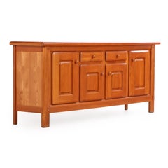 A French elm sideboard attributed to Maison Regain, C. 1960.