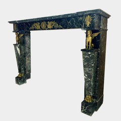 A French Empire Egyptian Revival Marble and Ormolu Fireplace Mantel