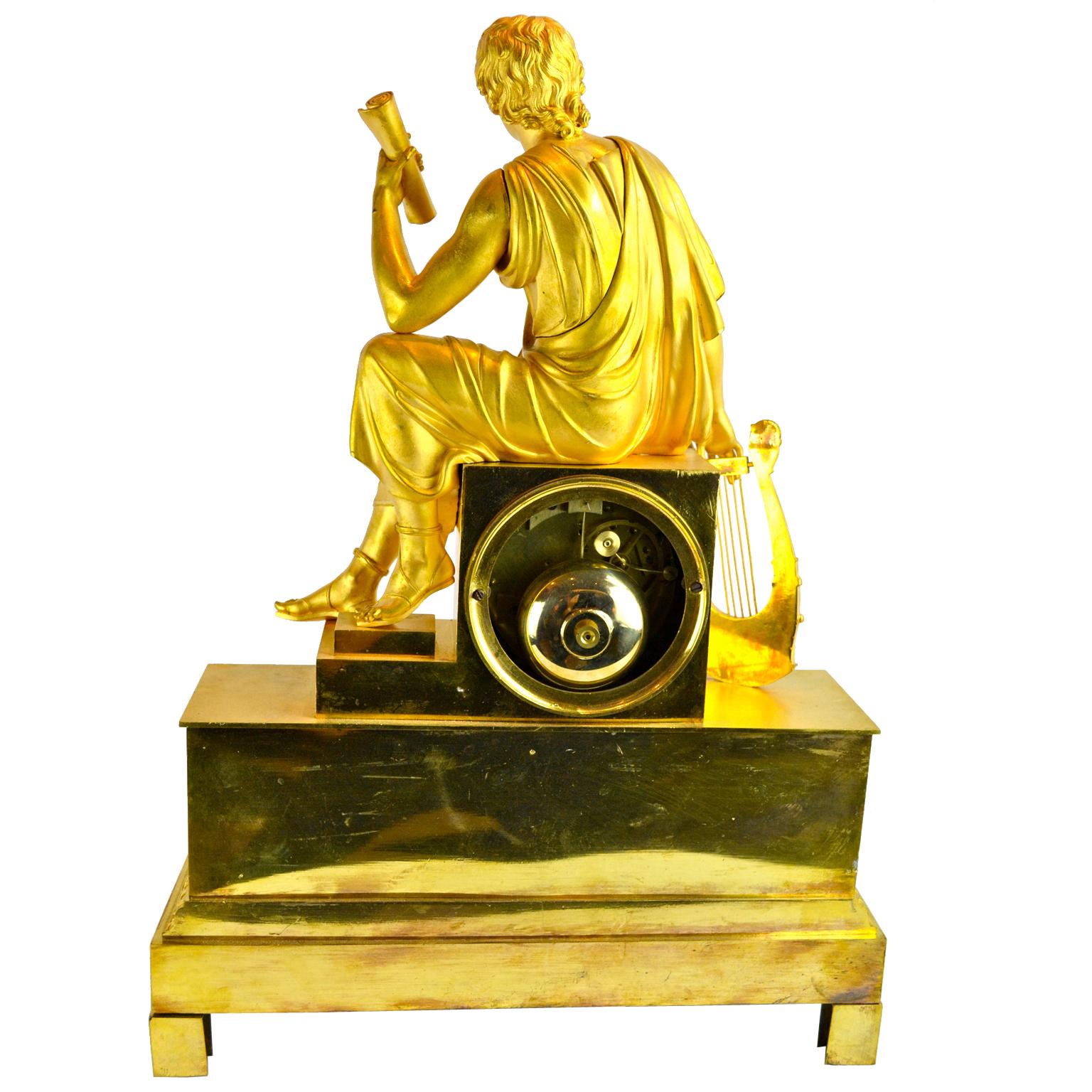 French Empire Figurative Gilt Bronze Clock of a Roman Youth Holding a Scroll For Sale 2