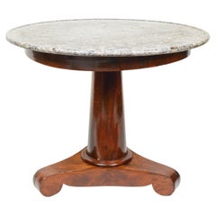 A French Empire Mahogany Gueridon with a Gray Marble Top