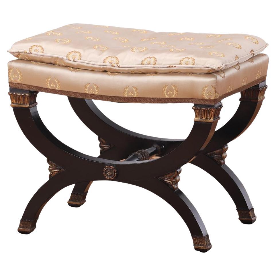 A French Empire style ebonized and giltwood stool, C. 1940.