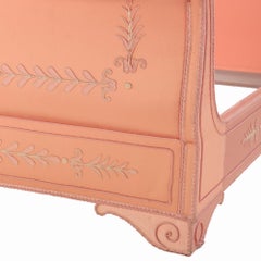 A French Empire style painted and upholstered full size sleigh bed.