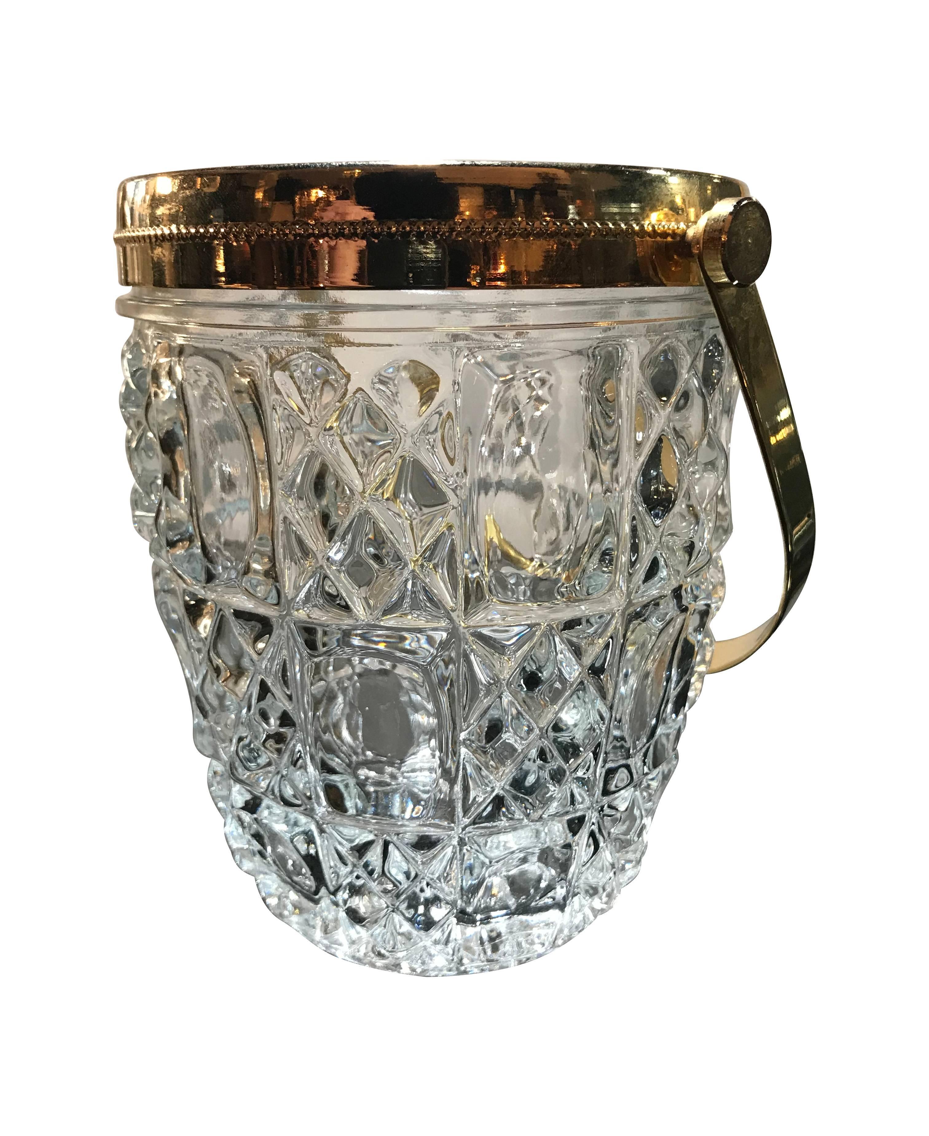 A French faceted glass ice bucket with gilt metal rim and handle.