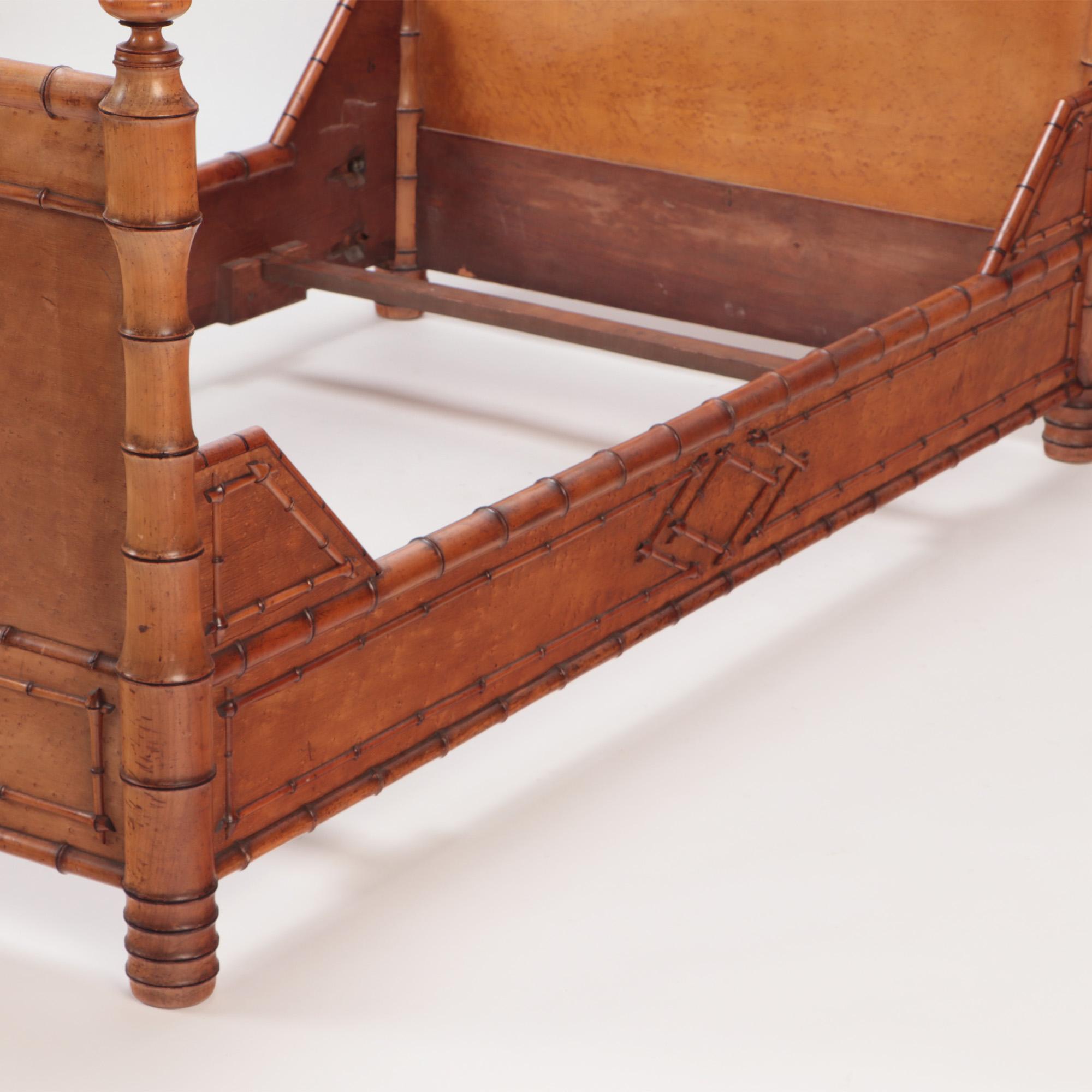 A French faux bamboo birds eye maple twin bed  with a triangular frame headboard. C 1880
Interior dimensions: 40.5