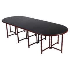A French faux bamboo dining room table, in the manner of Jansen, C. 1960.