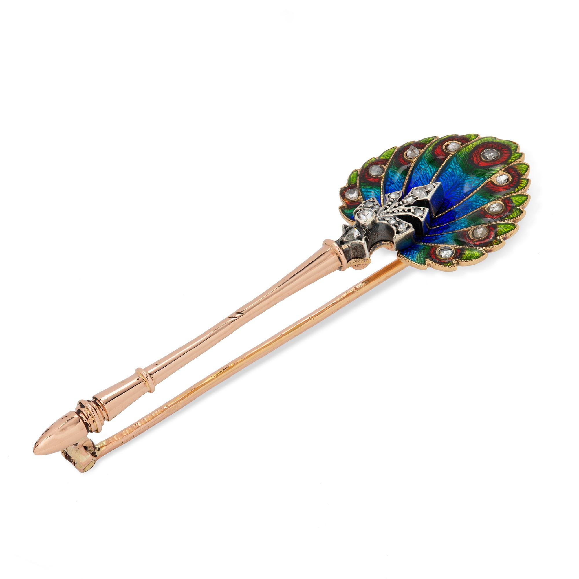 A French fin de siècle enamel and diamond peacock fan pin, consisting of nine multicolour enamelled feathers each bearing a rose-cut diamond, to a rose-cut diamond-set palmette decoration and rose-gold handle, with red gold brooch fitting, bearing