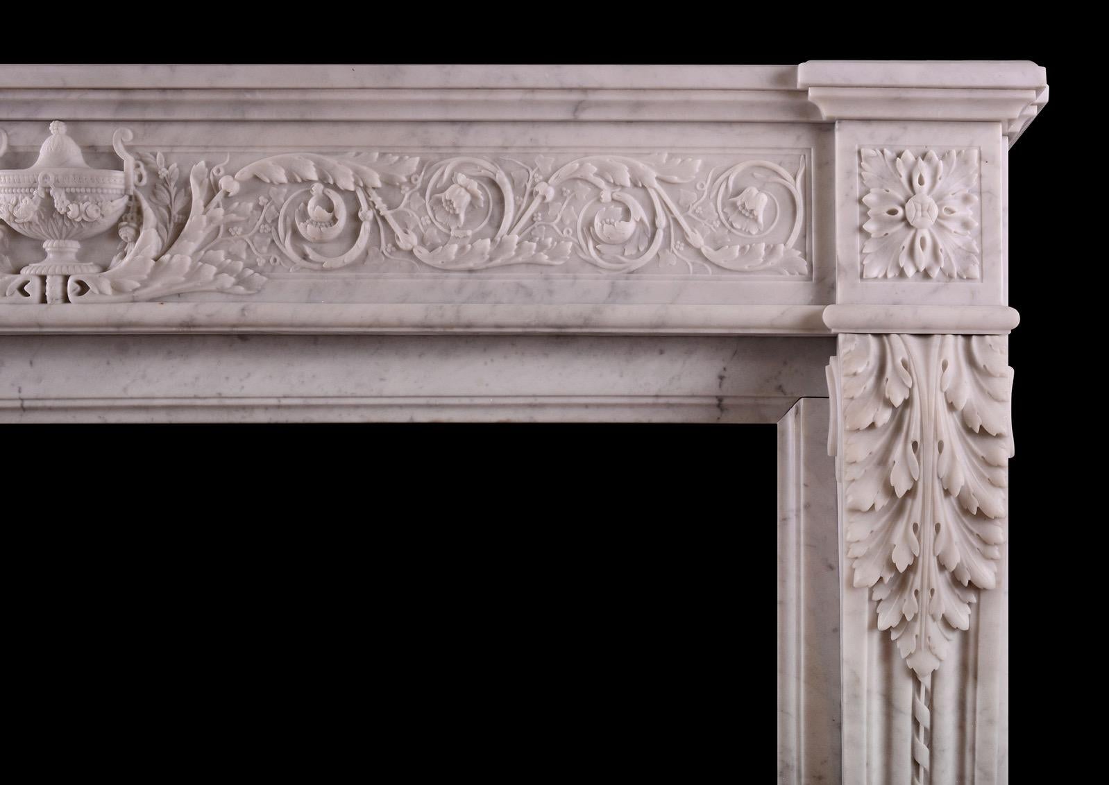 A fine quality 19th century French fireplace in the Louis XVI manner. The scrolled jambs with rope moulding and carved acanthus leaves. The finely carved frieze with scrollwork, foliage and classical urn to centre flanked by square carved paterae to