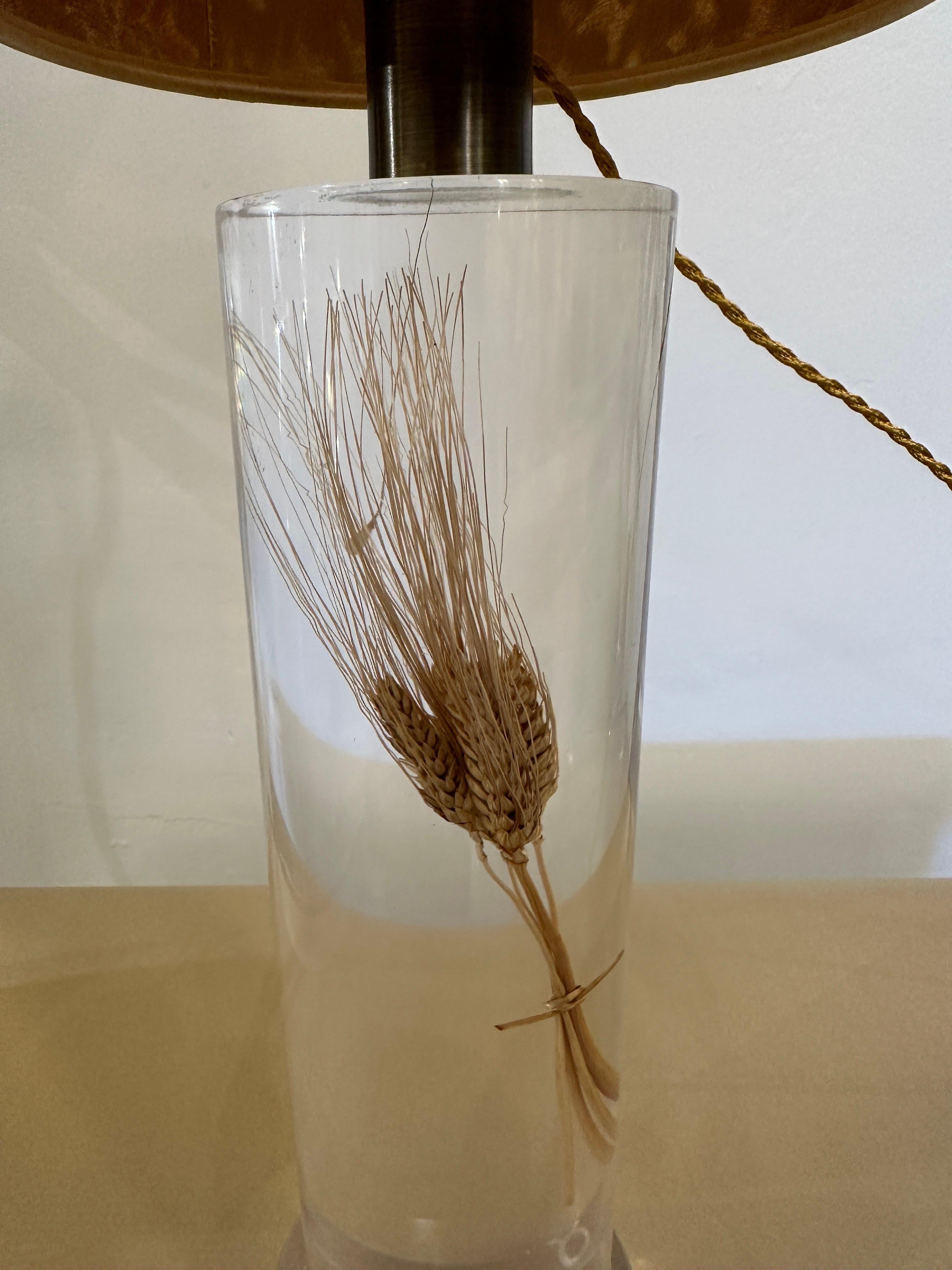 This lovely single French acrylic lamp by Pierre Giraudon features perfectly floating stalks of wheat in a cylinder and while illuminated they literally glow along with complimentary gold silk twist cable (newly rewired). The lamp and shade is