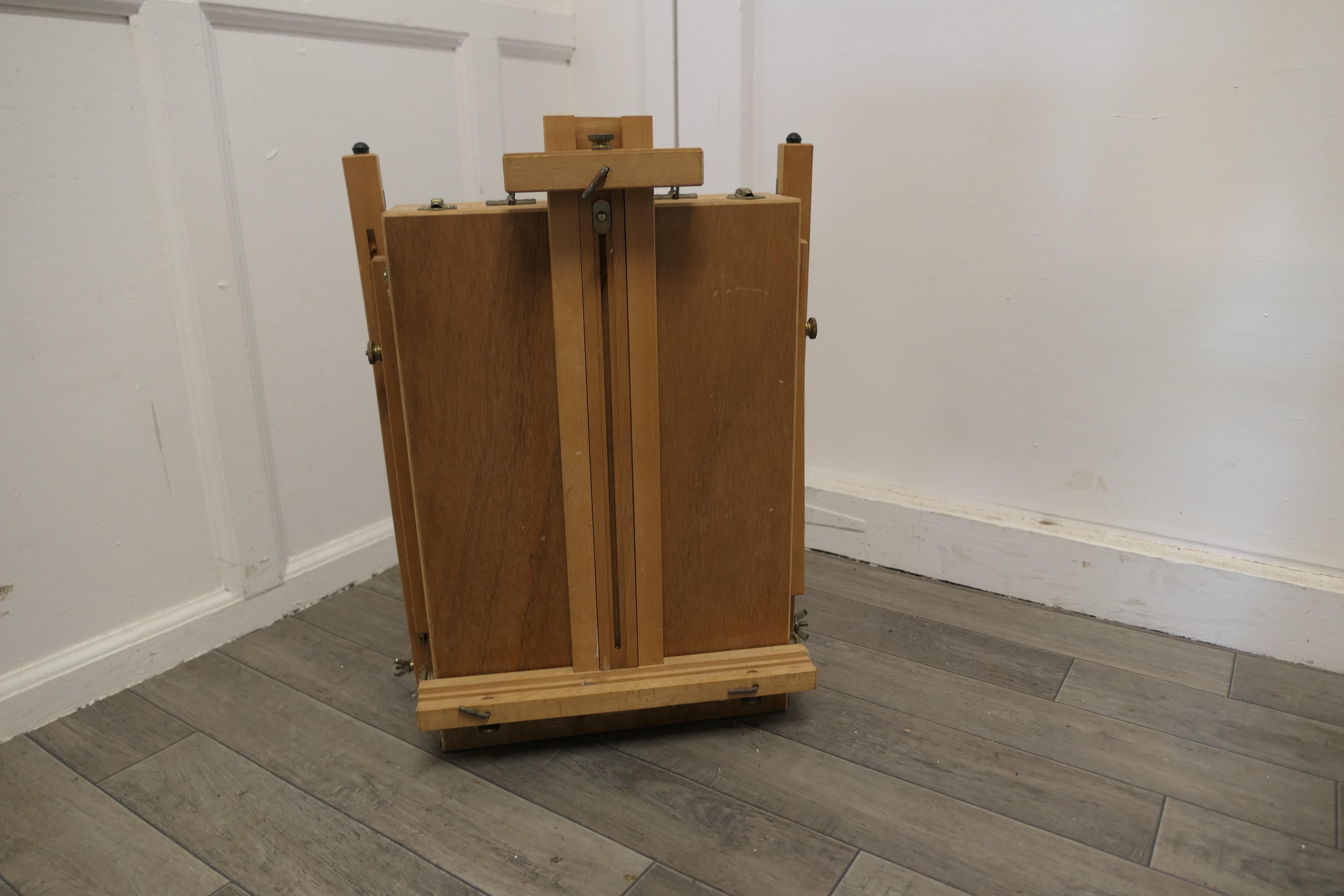 A French folding easel, artists suitcase easel and pallet. 
 
This charming set comes from Paris, the easel folds down completely into a delightful and easy to carry suitcase form, the pallet fits inside making it the perfect carry anywhere