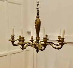 A French Gilded Brass 8 Branch Rococo Chandelier (Candelier)