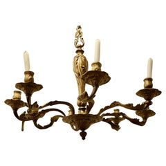 A French Gilded Brass 8 Branch Rococo Chandelier (Candelier)  