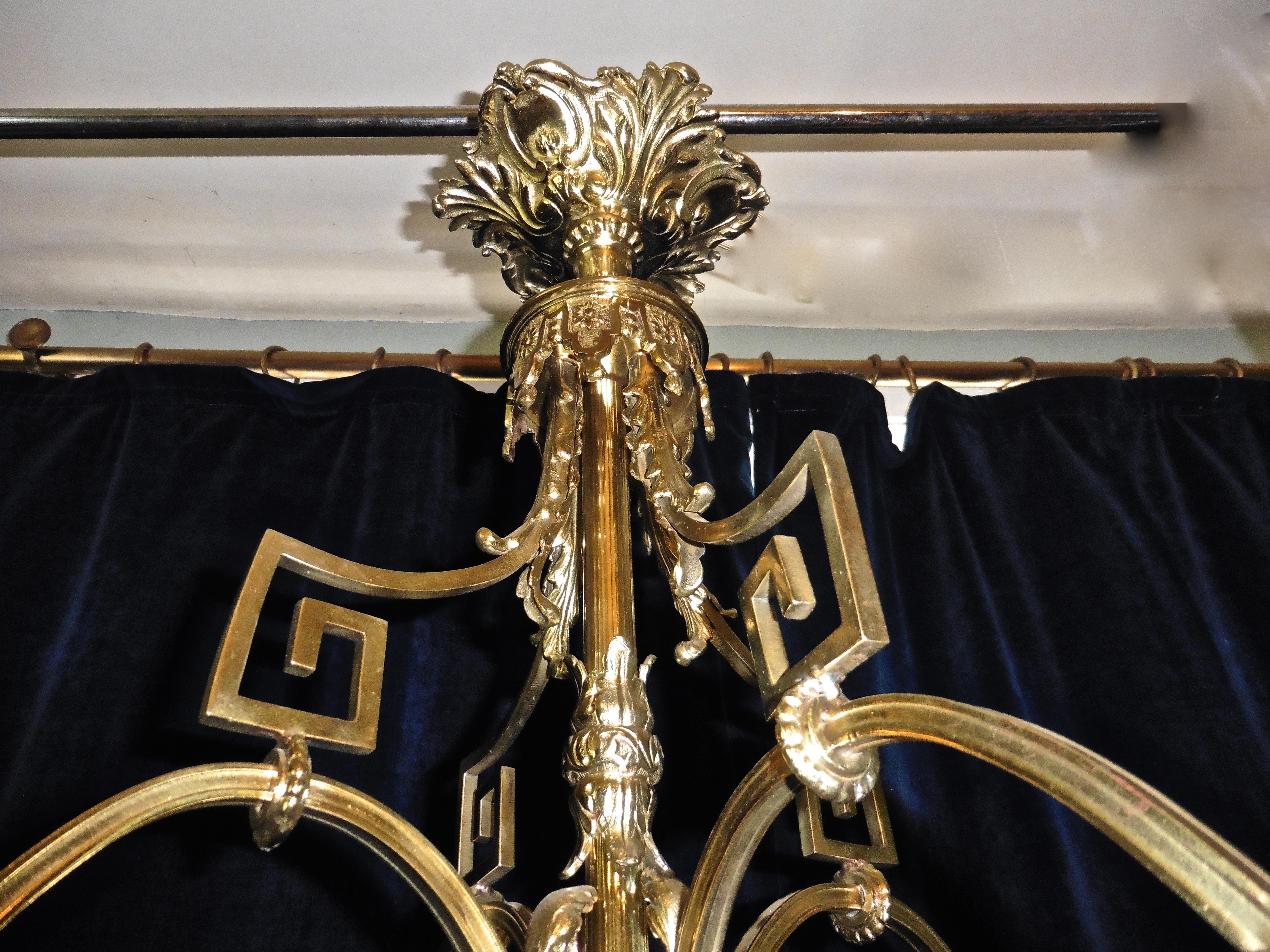 A French gilded brass Rococo chandelier. 

This is an excellent quality and very large piece it is very heavy and has a superb aged finish, the piece has an attractive ceiling Rose decorated with acanthus leaves matching the scrolled arms and