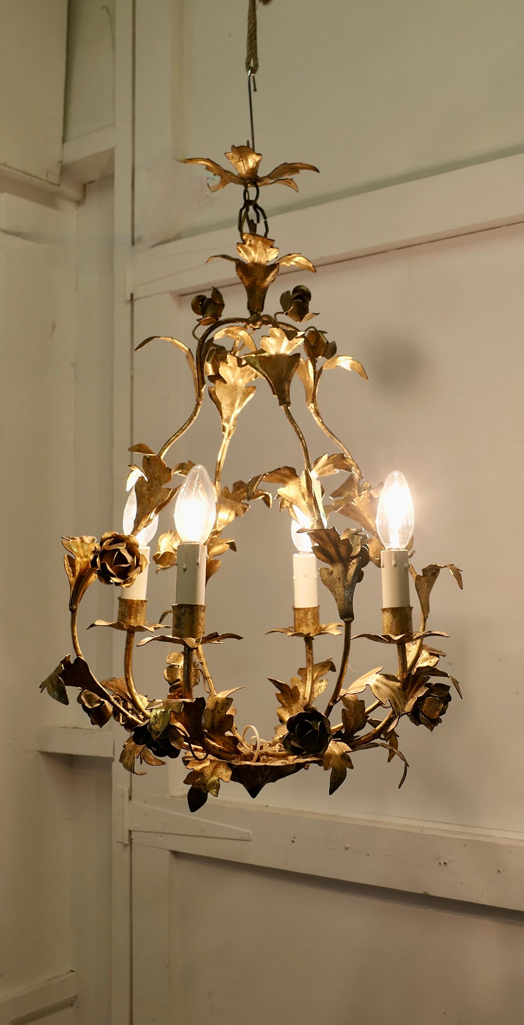 A French Gilt Toleware Open Basket Ceiling Light

This is a very decorative circular ceiling light, the light is open in the centre and is decorated with gilded leaves and flowers 
A very unusual wall light, it is made in French Toleware and a great