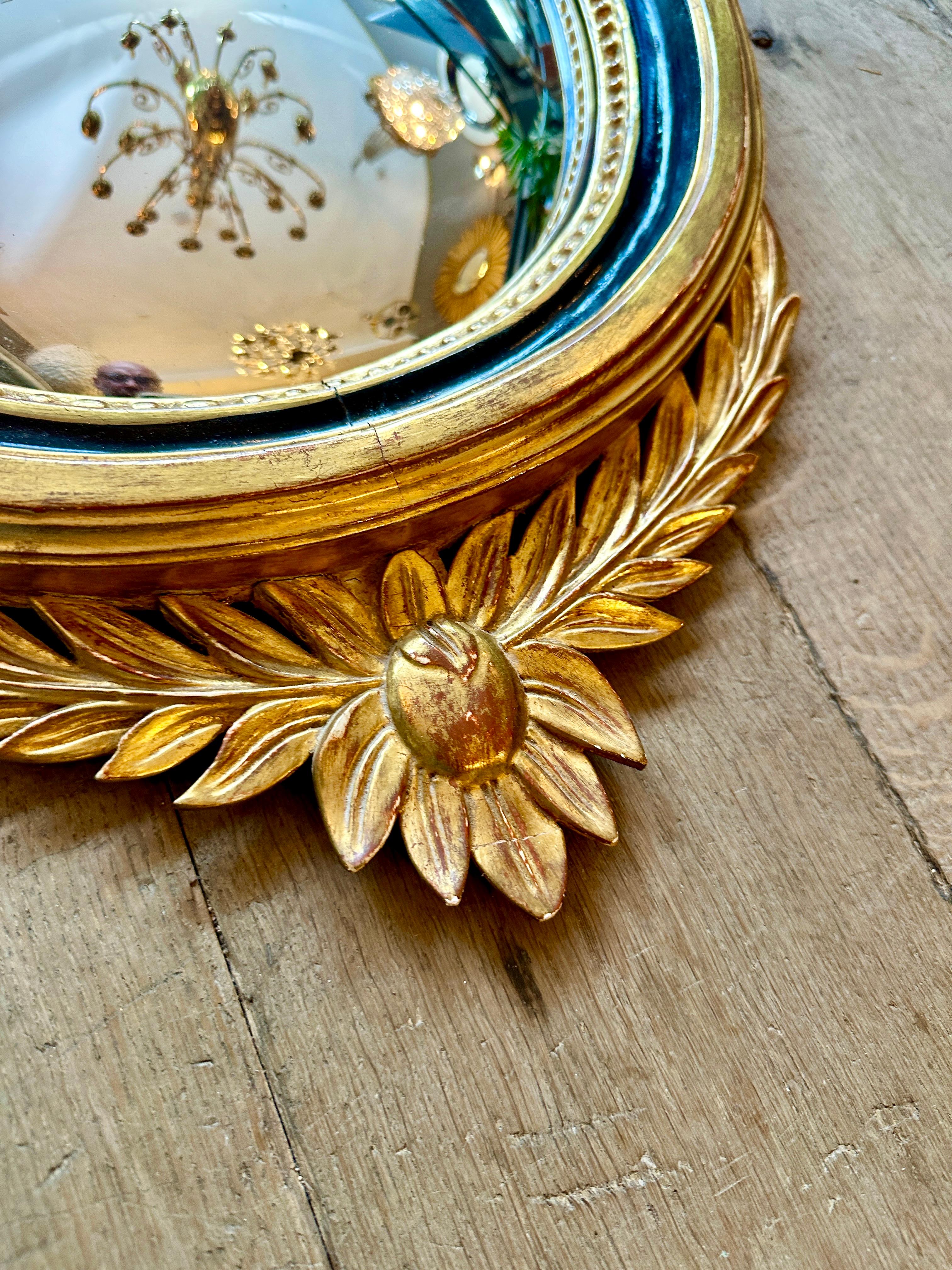 19th Century A French Gold Gilt Oval  Convex  Eagle Crested Mirror