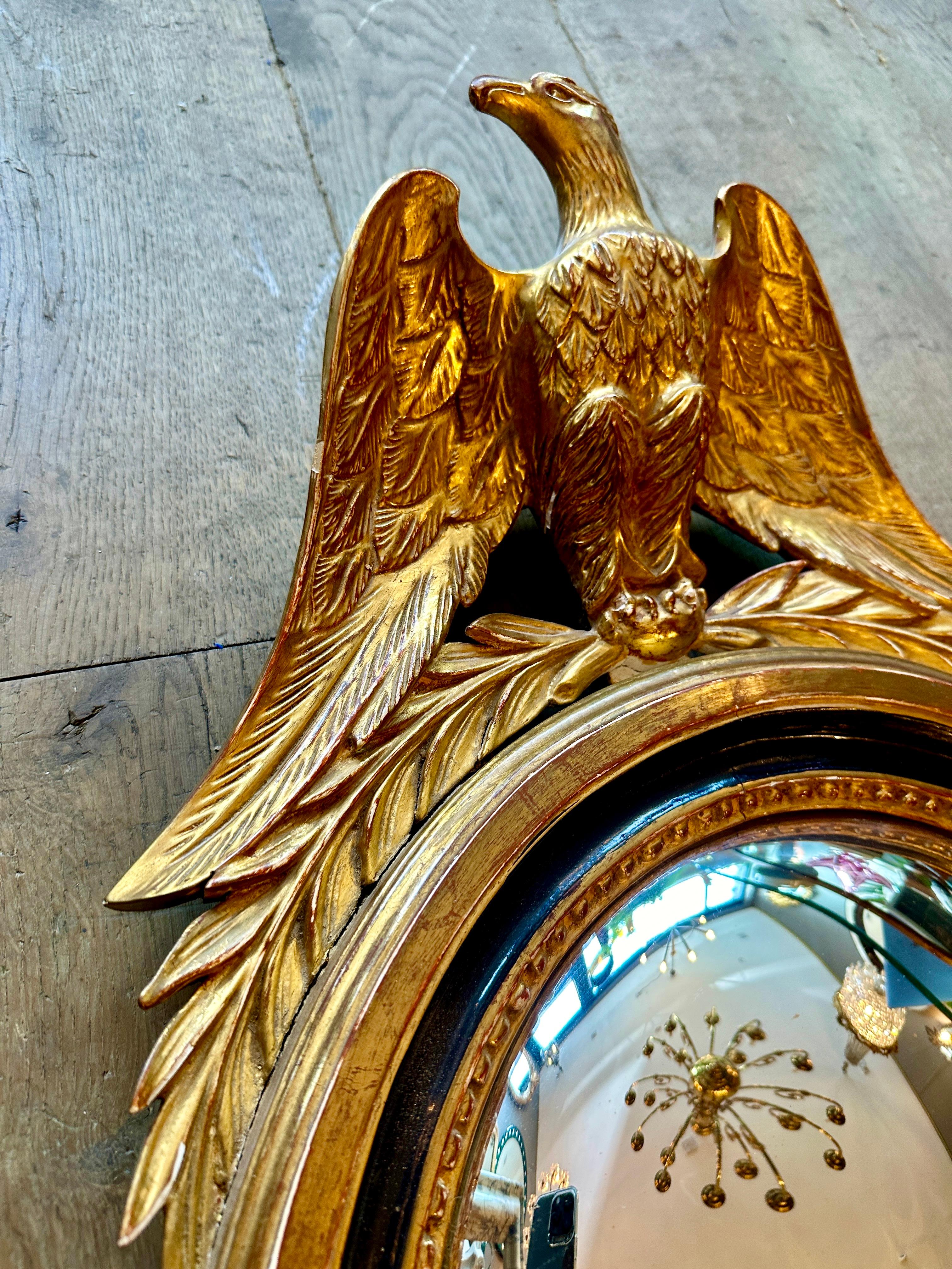 A French Gold Gilt Oval  Convex  Eagle Crested Mirror 1