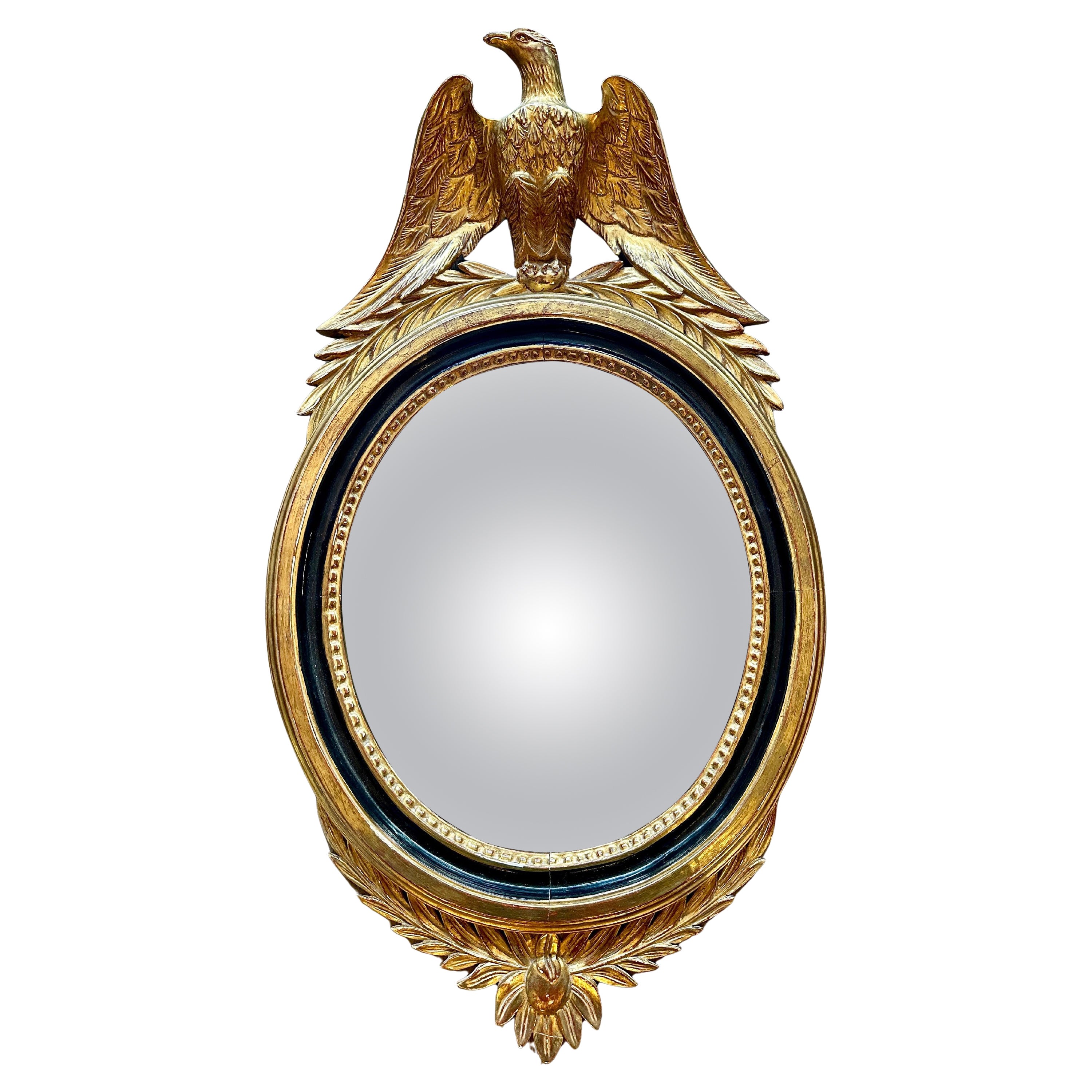 A French Gold Gilt Oval  Convex  Eagle Crested Mirror