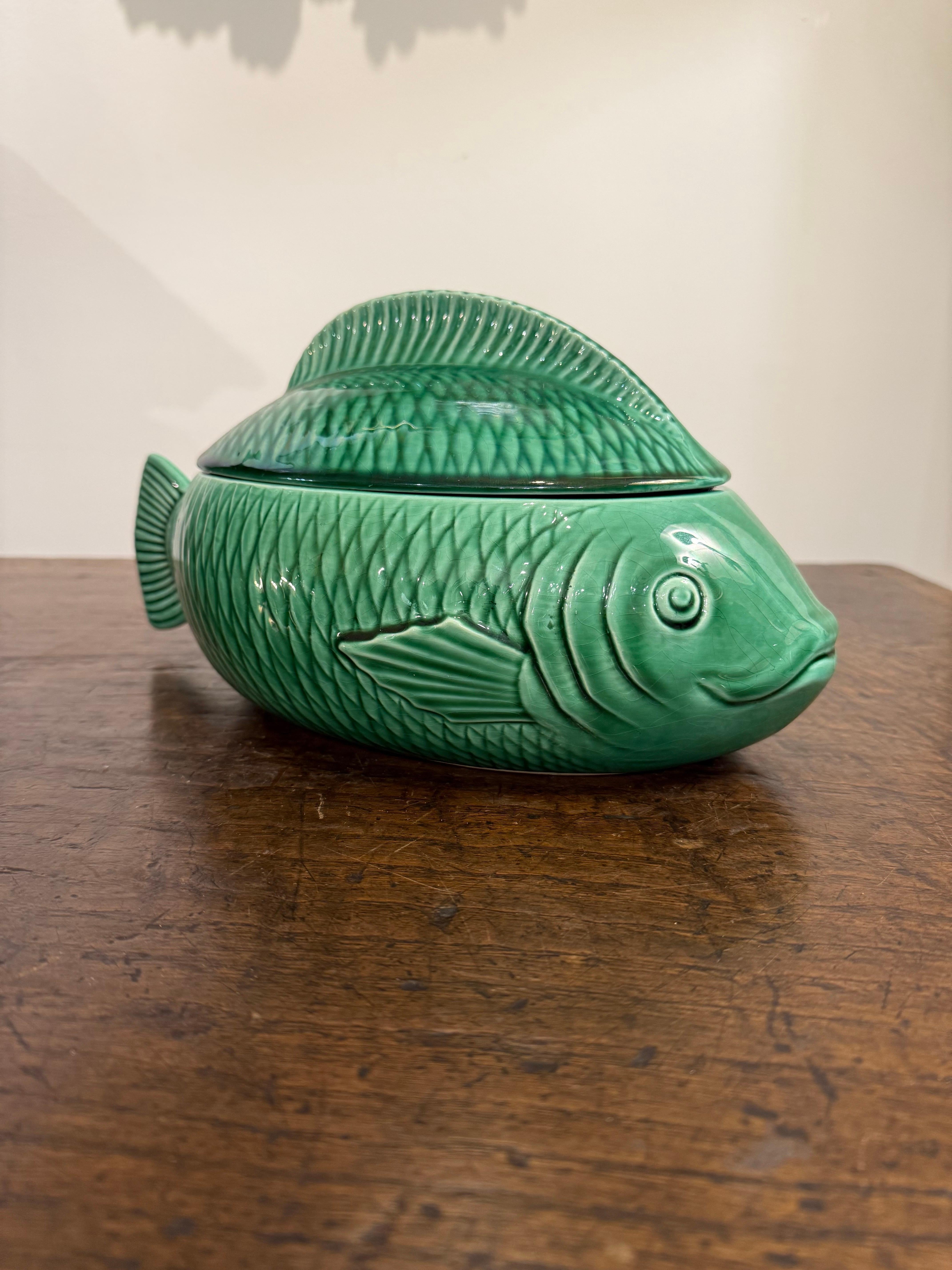 A French Green Majolica Fish Tureen by Sarreguemines, Mid 20th Century

Provenance: Private Australian Collection.

Dimensions:
Width: 30cm.
Height: 15cm.
Depth: 16cm.