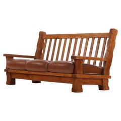 A French Heavy Oak Brutalist style Open Arm Sofa, C. 1960.