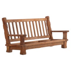 A French Heavy Oak Brutalist style Open Arm Sofa Frame, C. 1960.