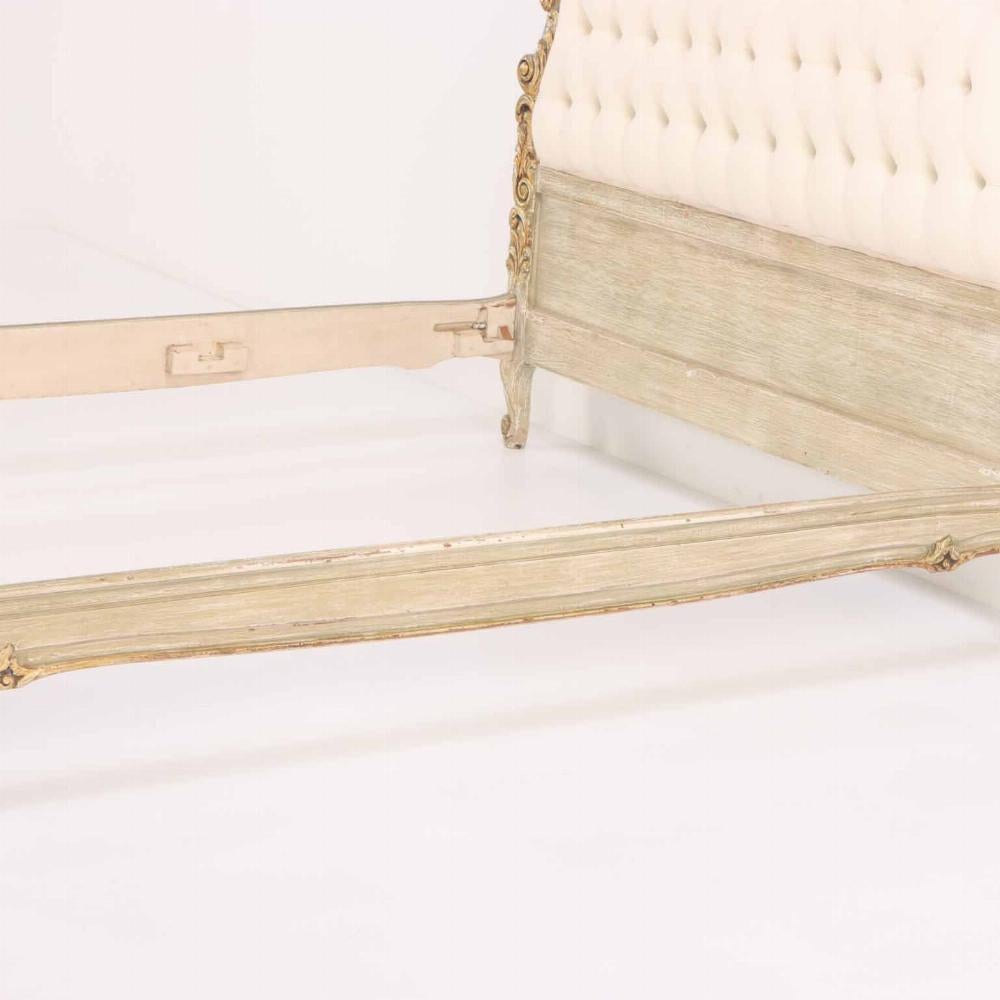This beautiful French bed will add more than a touch of luxurious comfort to any bedroom. With new button tufted upholstery, the giltwood frame provides an opulent border and timeless, regal appeal.

Interior Wd: 56.5
