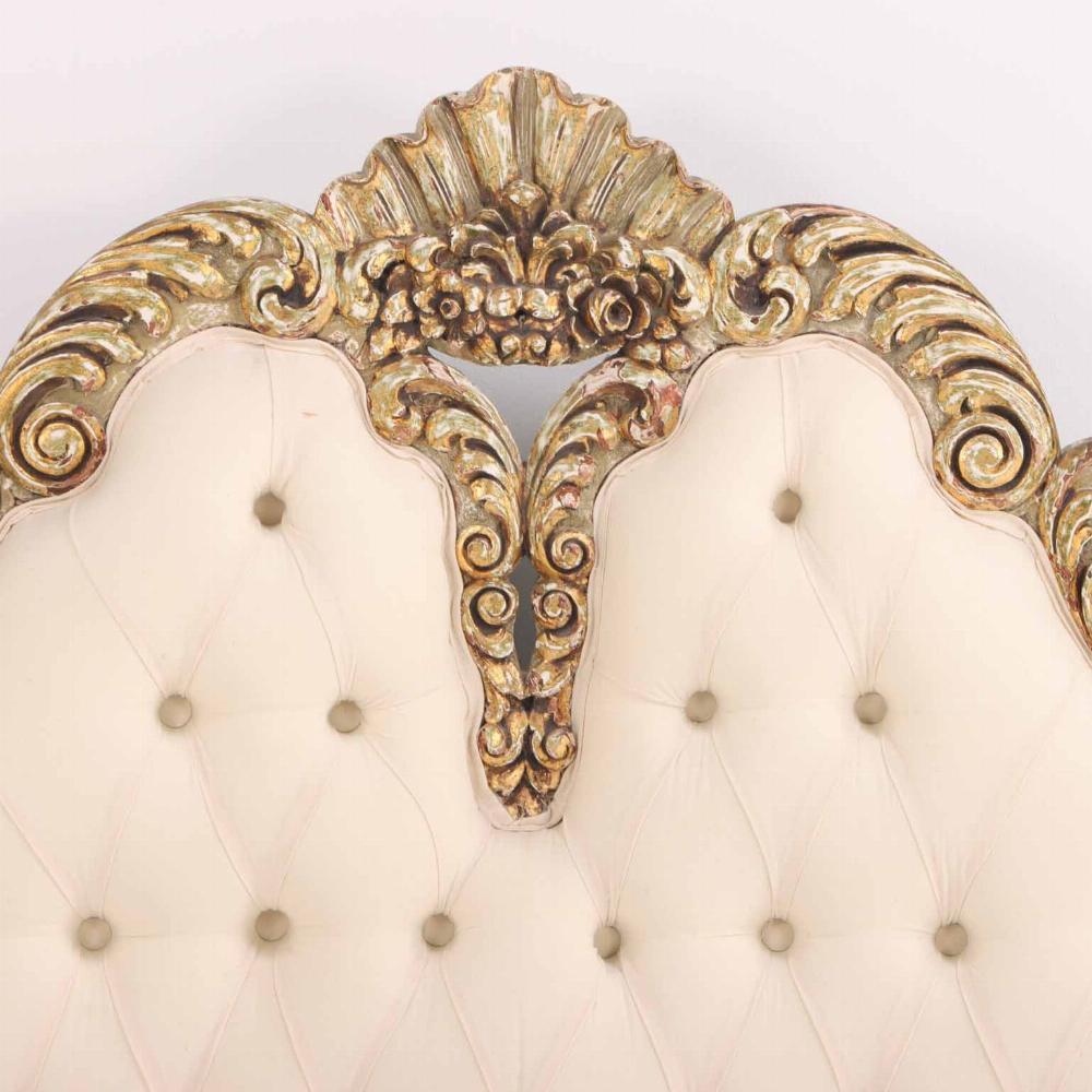 Upholstery A French Hollywood Regency style painted and gilt carved full size bed, C. 1940. For Sale