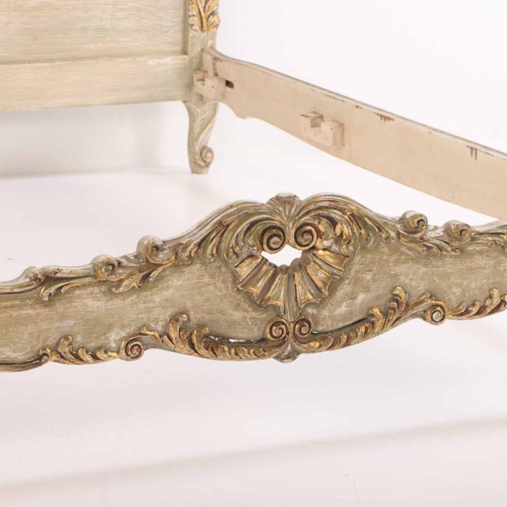 A French Hollywood Regency style painted and gilt carved full size bed, C. 1940. For Sale 1