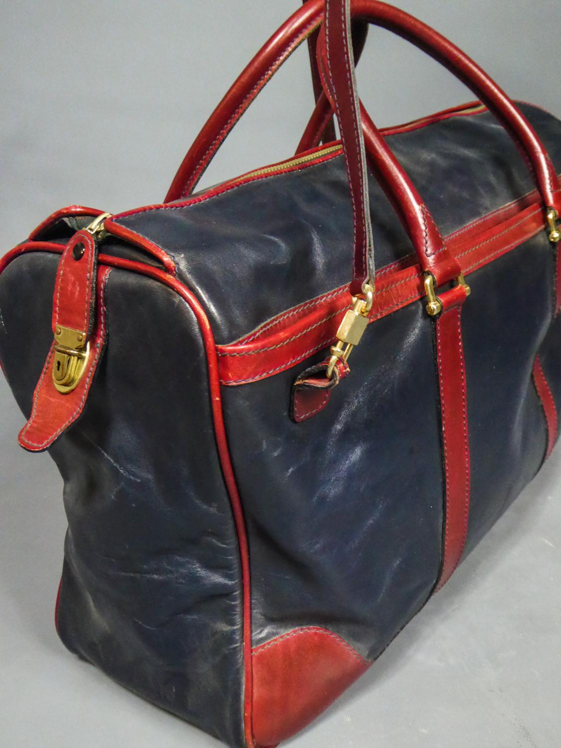 Circa 1980
France

Travel or Weekend bag in two-tone leather from the luxury leather goods designer house Clément in Lyon and dating from the 1980s. Beautiful luxury collection item from French tradition in supple, waxed burgundy and navy blue
