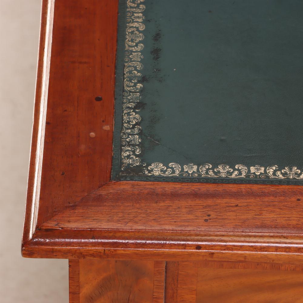 20th Century A French Louis XIV style mahogany and crotch mahogany leather top desk, C 1900.