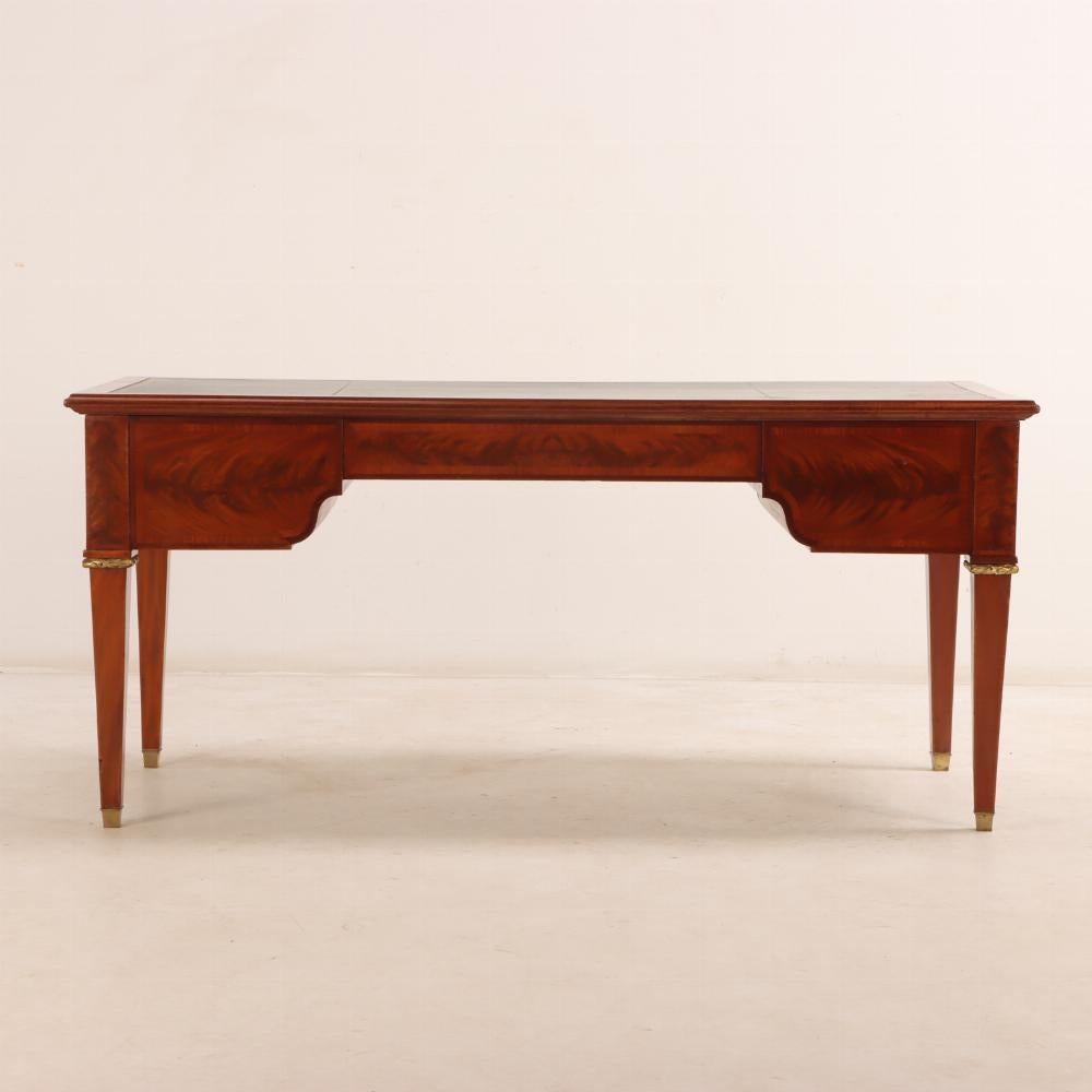 A French Louis XIV style mahogany and crotch mahogany leather top desk, C 1900. 1