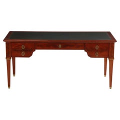 A French Louis XIV style mahogany and crotch mahogany leather top desk, C 1900.