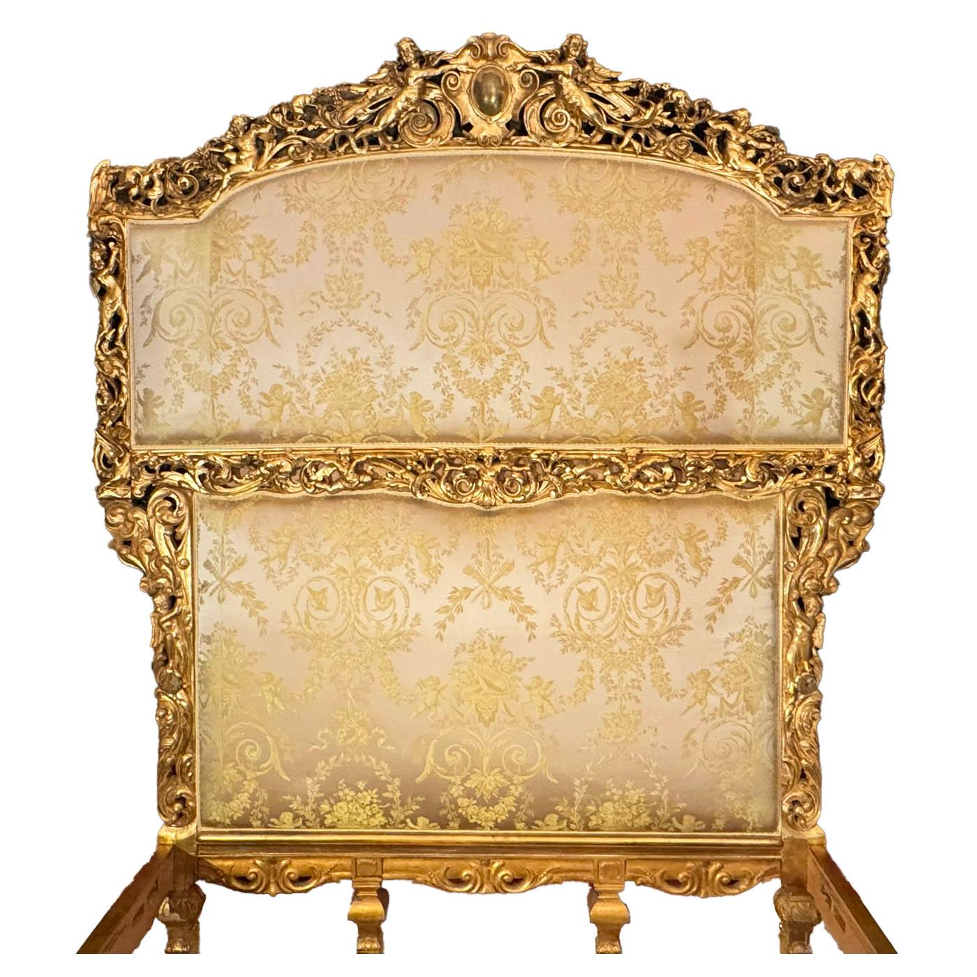 A French Louis XIX/XV Style Giltwood Carved 'Baroque Revival' Figural Queen-Size Bed with Cherubs. The tall ornately pierced carved headboard, crowned with an allegorical pair of cherubs holding a crest, flanked by other angels, winged dragons,