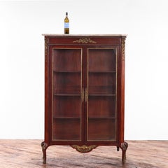 A French Louis XV Revival (Belle Époque) mahogany marble top vitrine