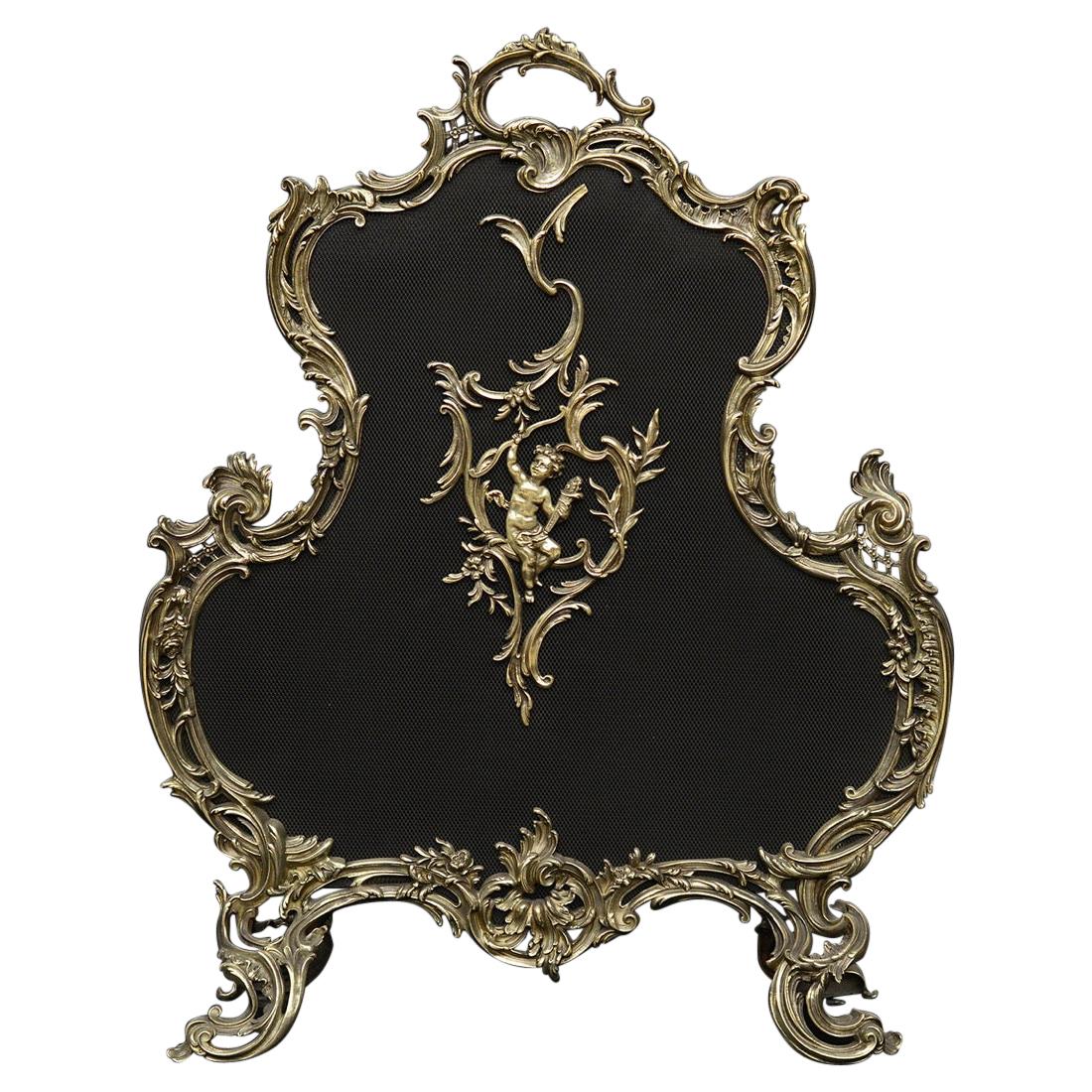 Pare-étincelles français de style Louis XV en laiton avec volutes et forme de feuille