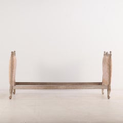 A French Louis XV style carved and painted daybed C 1900.
